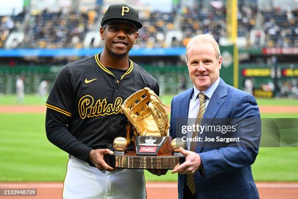 Ke'Bryan Hayes of the Pittsburgh Pirates poses with his Rawlings Gold Glove Award prior to the game between the Baltimore Orioles and the Pittsburgh...