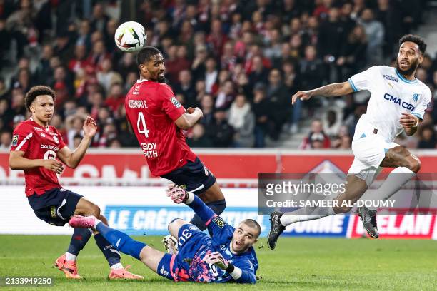 Lille's French goalkeeper Lucas Chevalier eyes the ball during the French L1 football match between Lille LOSC and Olympique Marseille at Stade...