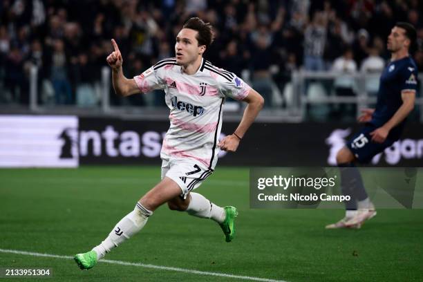 Federico Chiesa of Juventus FC celebrates after scoring the opening goal as Nicolo Casale of SS Lazio looks dejected during the Coppa Italia semi...