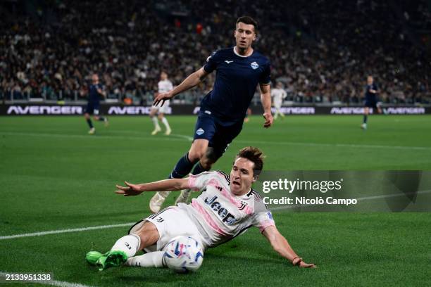 Federico Chiesa of Juventus FC competes for the ball with Nicolo Casale of SS Lazio during the Coppa Italia semi final first leg football match...