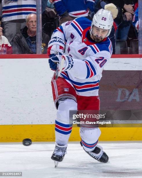 Chris Kreider of the New York Rangers shoots the puck in warm ups before the game against the Detroit Red Wings at Little Caesars Arena on April 5,...