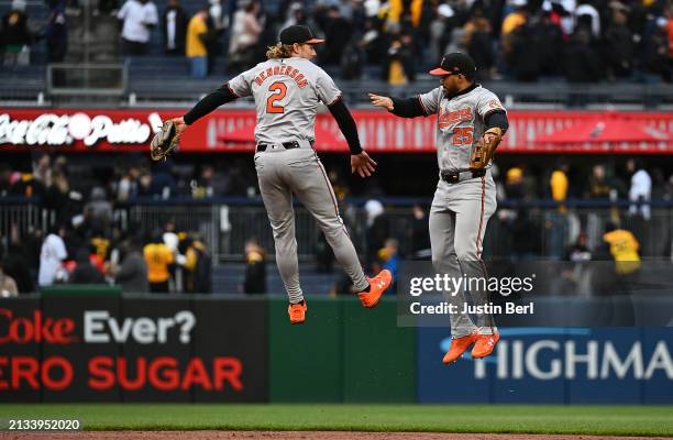 Gunnar Henderson of the Baltimore Orioles celebrates with Anthony Santander after the final out in a 5-2 win over the Pittsburgh Pirates during the...