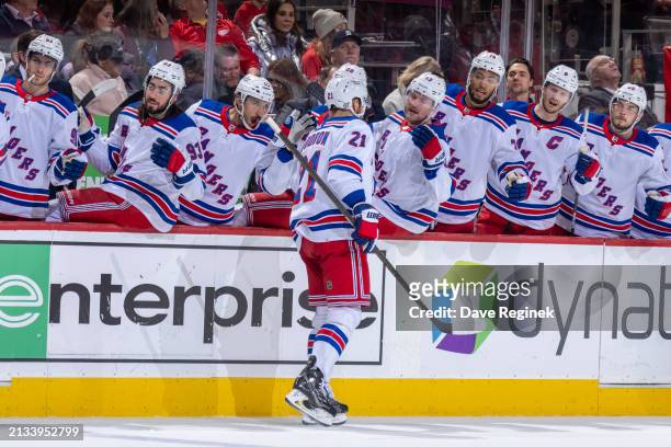 Barclay Goodrow of the New York Rangers celebrates his goal against the Detroit Red Wings with teammates on the bench during the second period at...