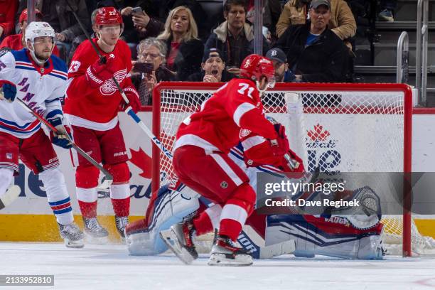 Jonathan Quick of the New York Rangers robs a goal on a backhand shot from Dylan Larkin of the Detroit Red Wings during the second period at Little...