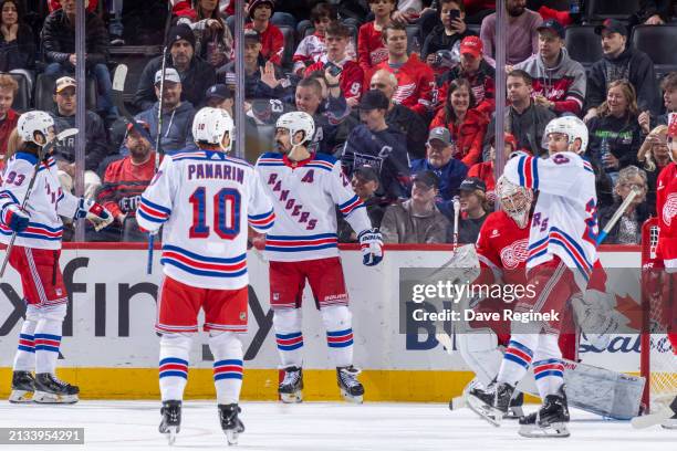 Chris Kreider of the New York Rangers scores a goal on Alex Lyon of the Detroit Red Wings during the third period at Little Caesars Arena on April 5,...