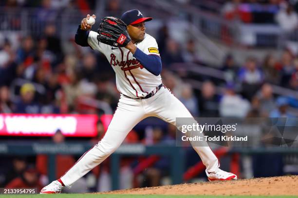 Raisel Iglesias of the Atlanta Braves throws to second for an out in the ninth inning during the game between the Arizona Diamondbacks and the...