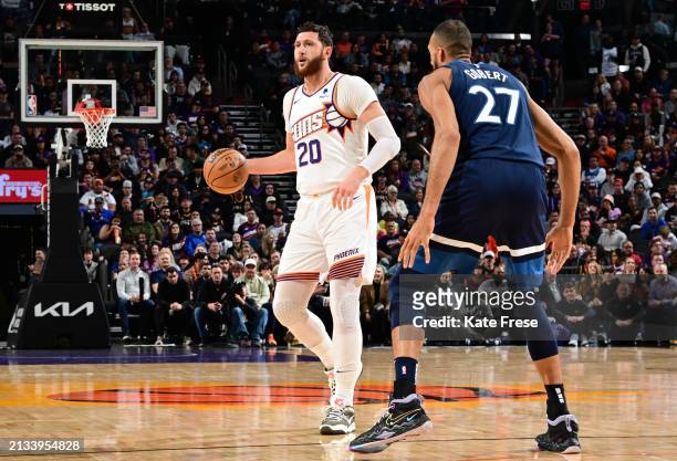 Jusuf Nurkic of the Phoenix Suns handles the ball against Rudy Gobert of the Minnesota Timberwolves during the game on April 5, 2024 at Footprint...