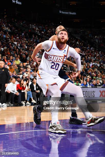 Jusuf Nurkic of the Phoenix Suns boxes out against Rudy Gobert of the Minnesota Timberwolves during the game on April 5, 2024 at Footprint Center in...