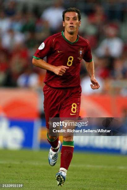 June 11: Petit of Portugal running during the FIFA World Cup Finals 2006 Group D match between Angola and Portugal at Rheinenergie Stadion on June...