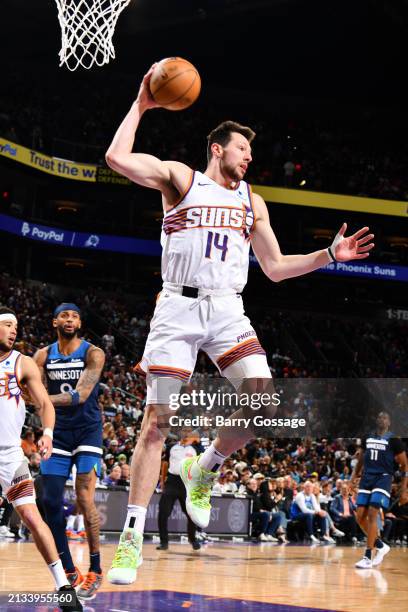 Jusuf Nurkic of the Phoenix Suns grabs the rebound during the game against the Minnesota Timberwolves on April 5, 2024 at Footprint Center in...