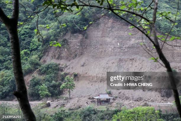 Pavilion in the Taroko National Park is seen beside earth and debris from an earthquake-induced landslide in Hualien on April 6, 2024. Ten people...