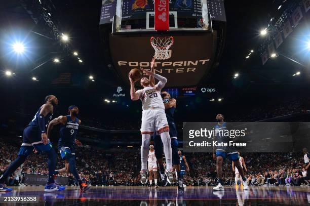 Jusuf Nurkic of the Phoenix Suns drives to the basket during the game against the Minnesota Timberwolves on April 5, 2024 at Footprint Center in...