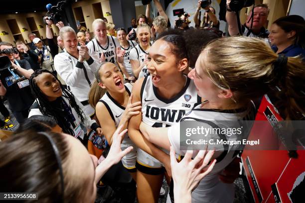 The Iowa Hawkeyes celebrate in the locker room after the game against the UConn Huskies during the NCAA Women's Basketball Tournament Final Four...