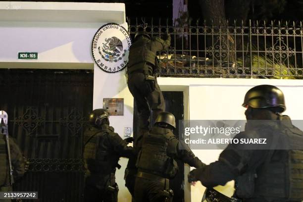 Picture released by API showing Ecuadorian police special forces breaking into the Mexican embassy in Quito to arrest Ecuador's former Vice President...