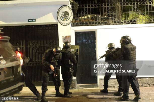 Picture released by API showing Ecuadorian police special forces attempting to break into the Mexican embassy in Quito to arrest Ecuador's former...