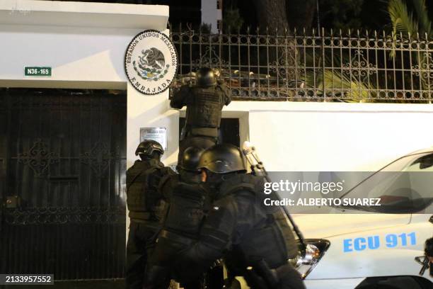 Picture released by API showing Ecuadorian police special forces attempting to break into the Mexican embassy in Quito to arrest Ecuador's former...