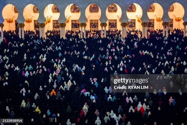 Women pray at the Sheikh Zayed Grand Mosque in Abu Dhabi in the early hours of April 6 on Laylat al-Qadr , one of the holiest nights during the...