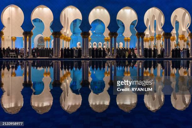 Women pray at the Sheikh Zayed Grand Mosque in Abu Dhabi in the early hours of April 6 on Laylat al-Qadr , one of the holiest nights during the...