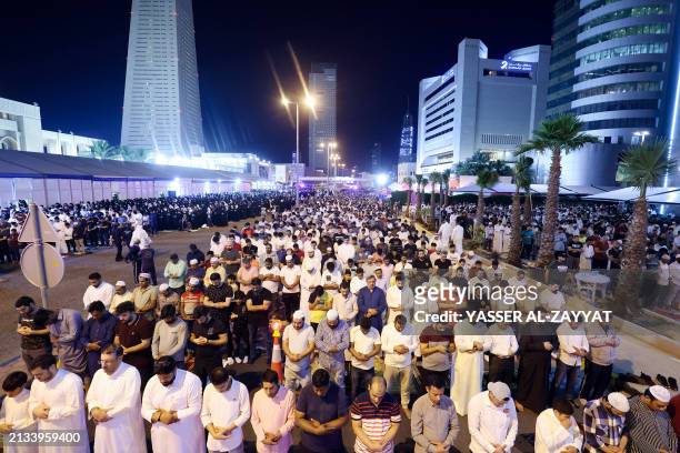 Men pray outside the Grand Mosque in Kuwait City in the early hours of April 6 on Laylat al-Qadr , one of the holiest nights during the Muslim holy...