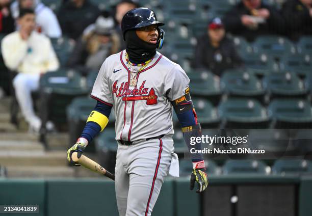 Ronald Acuña Jr. #13 of the Atlanta Braves reacts after striking out during the first inning of a game against the Chicago White Sox at Guaranteed...