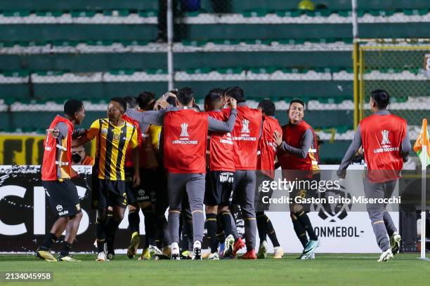 Luciano Ursino of The Strongest celebrates with teammates after scoring the team's first goal during the Copa CONMEBOL Libertadores Group C match...