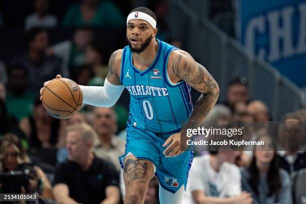 Miles Bridges of the Charlotte Hornets brings the ball up court during their game against the Boston Celtics at Spectrum Center on April 01, 2024 in...