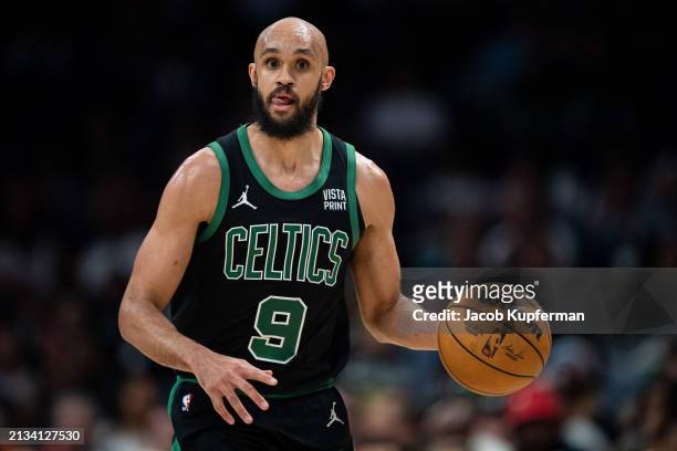 Derrick White of the Boston Celtics brings the ball up court against the Charlotte Hornets during their game at Spectrum Center on April 01, 2024 in...