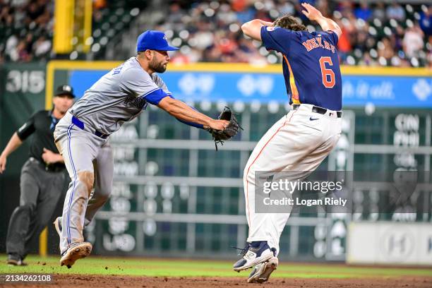 Isiah Kiner-Falefa of the Toronto Blue Jays tags out Jake Meyers of the Houston Astros who stumbled between the base paths trying to steal second...