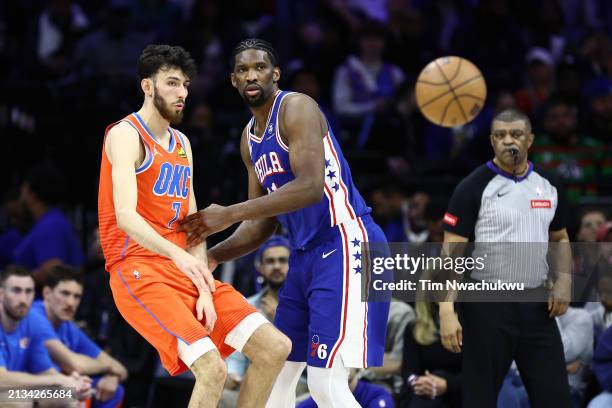 Chet Holmgren of the Oklahoma City Thunder passes the ball past Joel Embiid of the Philadelphia 76ers during the third quarter at the Wells Fargo...