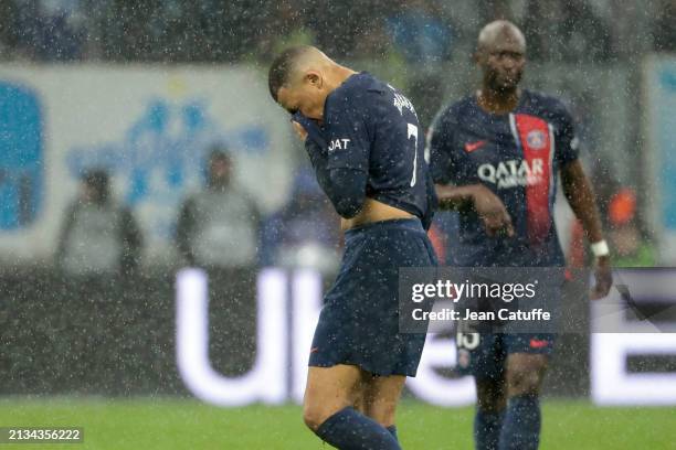 Kylian Mbappe of PSG looks down leaving the pitch when he's replaced during the second half-time of the Ligue 1 Uber Eats match between Olympique de...