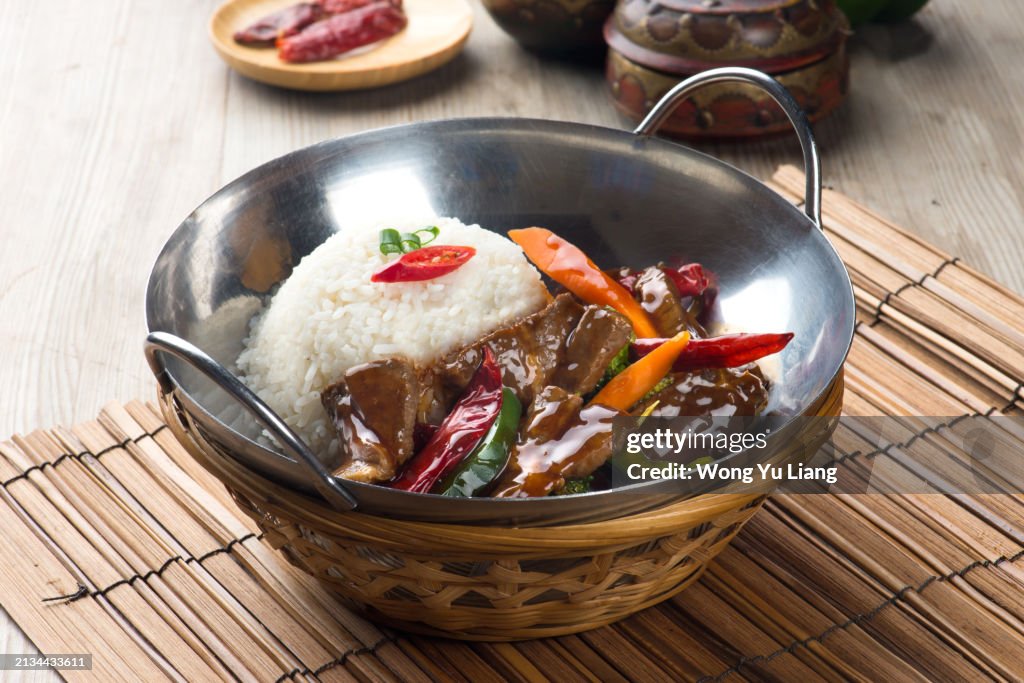Kung Pao Beef in wok and rice