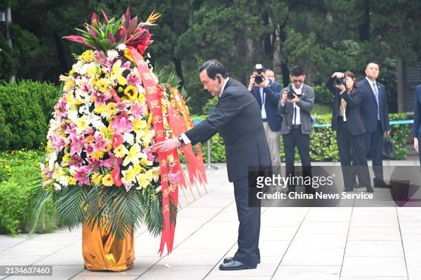 Former chairman of the Chinese Kuomintang party Ma Ying-jeou presents flowers to martyrs at the Huanghuagang Cemetery of the 72 Martyrs on April 3,...