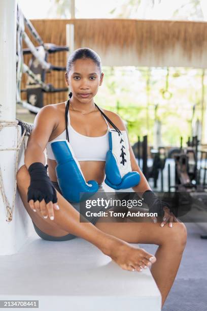 portrait of young woman boxer in gym - fighter portraits stock pictures, royalty-free photos & images