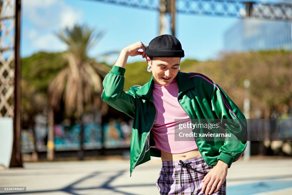 Young man in fashionable sports clothing, candid moment