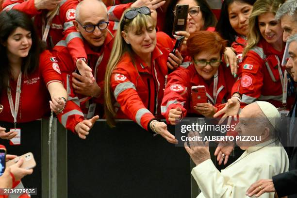 Pope Francis greets Italian Red Cross Volunteers after an audience on April 6, 2024 at Paul-VI hall in The Vatican.