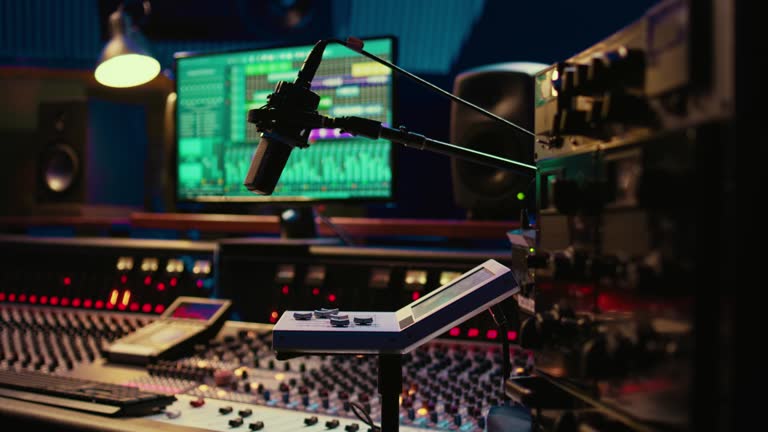 https://media.gettyimages.com/id/2134852738/video/control-room-desk-equipped-with-motorized-faders-and-amplifier.jpg?b=1&s=640x640&k=20&c=JSxGgRlW_5AGPPTSVTW-z6yH2hSZQJf87lPZ6Kt4iV0=