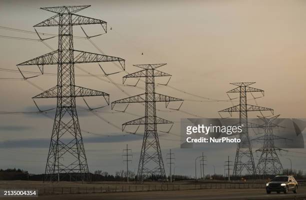Network of electric polles with wires seen along Edmonton Anthony Henday Drive in South Edmonton area, on April 3 in Edmonton, Alberta, Canada.
