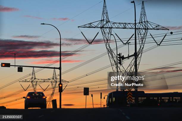 Network of electric polles with wires seen along Edmonton Anthony Henday Drive in South Edmonton area, on April 3 in Edmonton, Alberta, Canada.