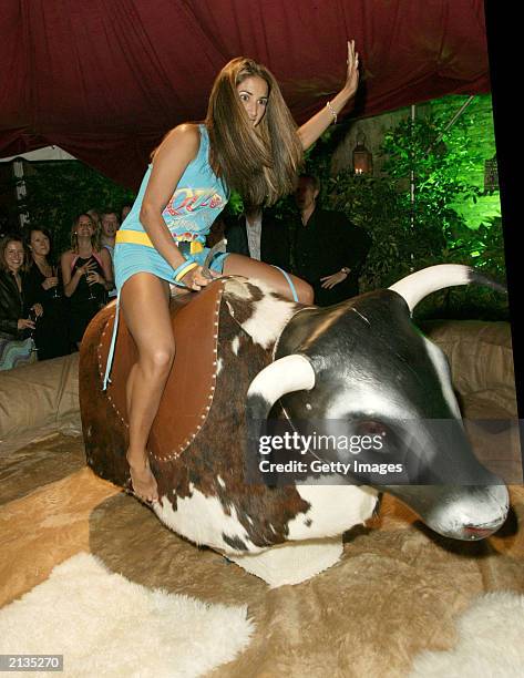 Page 3 Model Leilani rides a mechanical bull at the after-party for the' film "Charlies Angels 2: Full Throttle" at the In and Out Club on July 1,...