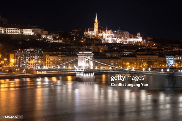 chain bridge, st. stephen's basilica and the river danube - chain bridge suspension bridge stock pictures, royalty-free photos & images