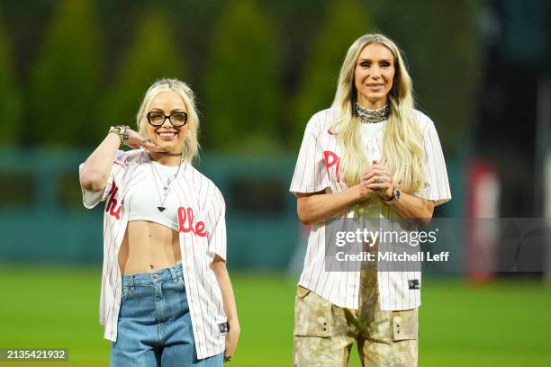 Wrestlers Liv Morgan and Charlotte Flair look on prior to the game between the Cincinnati Reds and Philadelphia Phillies at Citizens Bank Park on...