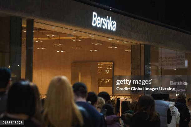 Shoppers wait in line to enter a Bershka store, that belongs to the Spanish Inditex group, during brand store reopening in the Respublika Park...