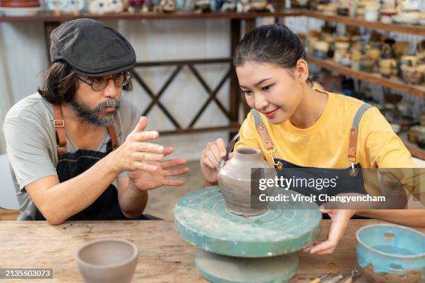 a ceramic artist is teaching students at art studio - east asian works of art specialist stock pictures, royalty-free photos & images