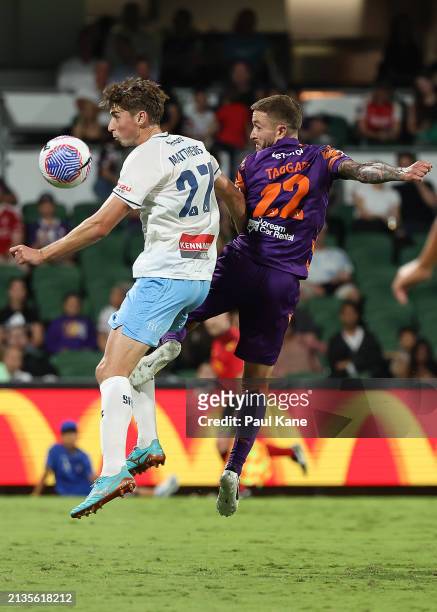 Hayden Matthews of Sydney and Adam Taggart of the Glory contest a header during the A-League Men round 12 match between Perth Glory and Sydney FC at...