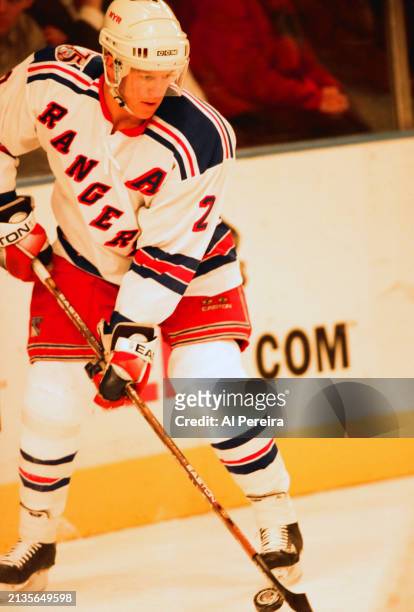 Defenseman Brian Leetch of the New York Rangers handles the puck in the game between the Buffalo Sabres vs the New York Rangers at Madison Square...