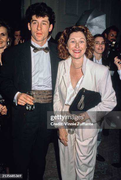 American actor Patrick Dempsey, wearing a tuxedo with a brown bow tie and matching cummerbund, and his wife, American actress Rochelle 'Rocky'...