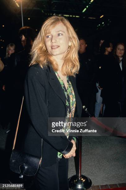 American actress Rebecca De Mornay, wearing a black jacket over a floral pattern shirt, attends the Burbank premiere of 'Bodies, Rest & Motion', at...