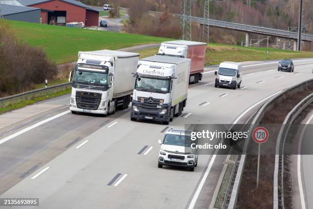 trucks and dense traffic on german highway a3 - rheingau stock pictures, royalty-free photos & images