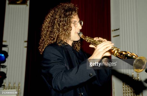 American smooth jazz saxophonist Kenny G play his sax during the Arista Records Pre-Party for 33rd Annual Grammy Awards on February 19 at the Plaza...