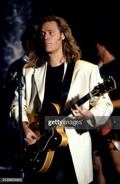 American musician Daryl Hall performs on stage with his guitar prior to a show in Los Angeles, California, circa 1990.